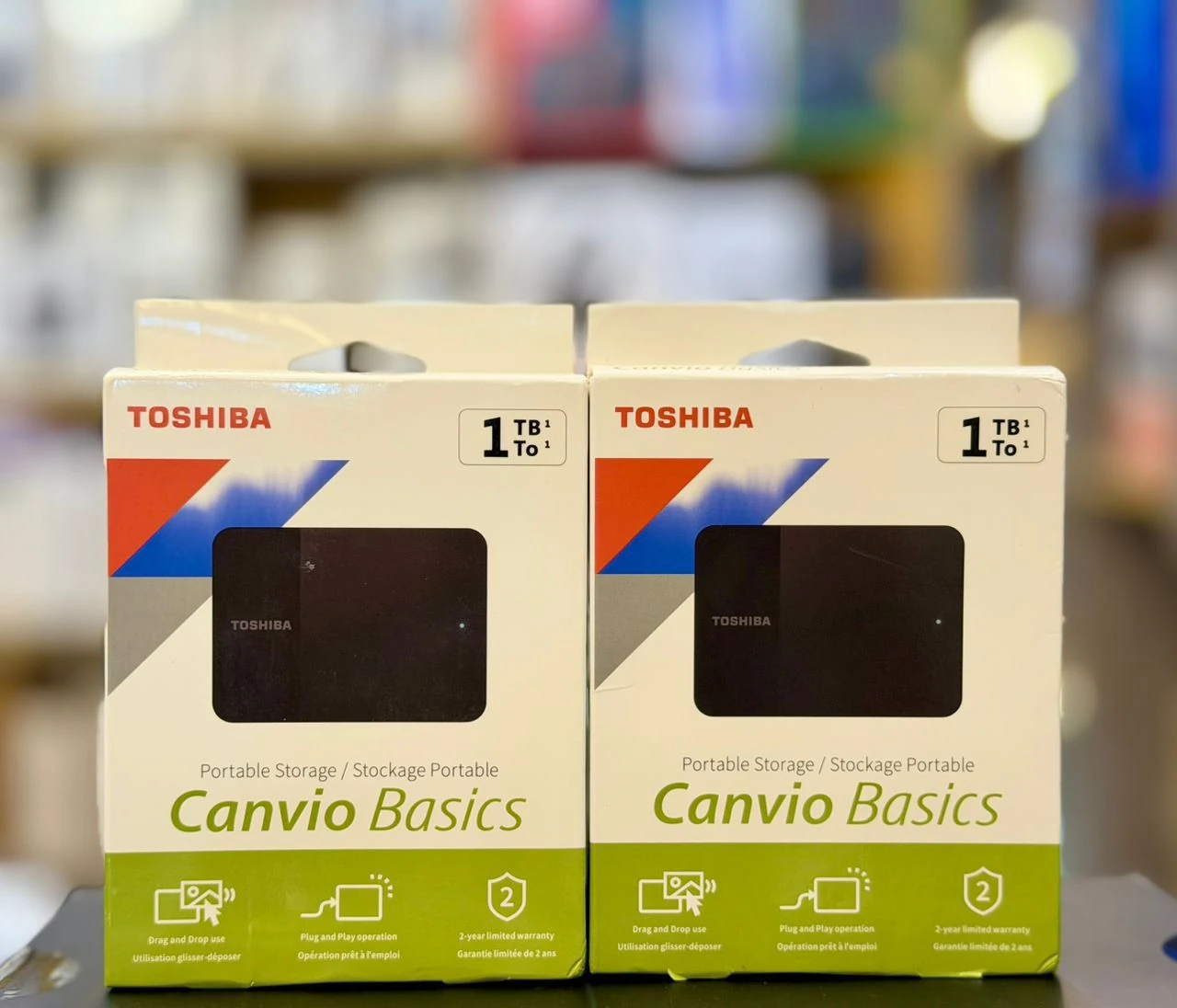 Toshiba Canvio Basics 1TB portable external hard drive retail packaging in EMOS IT SERVICES stock